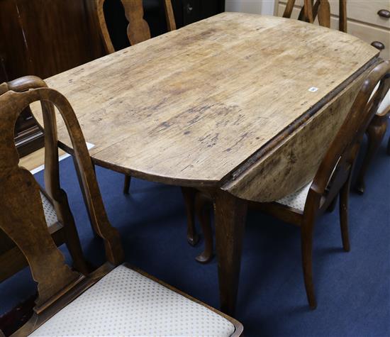 A 19th century fruitwood drop flap dining table W.131cm
